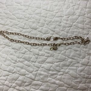 Silver necklace, hands